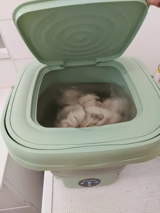 Kundeanmeldelse fra Mathilde med bilde av mini vaskemaskin